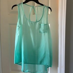 Sleeveless light green blouse. Size medium